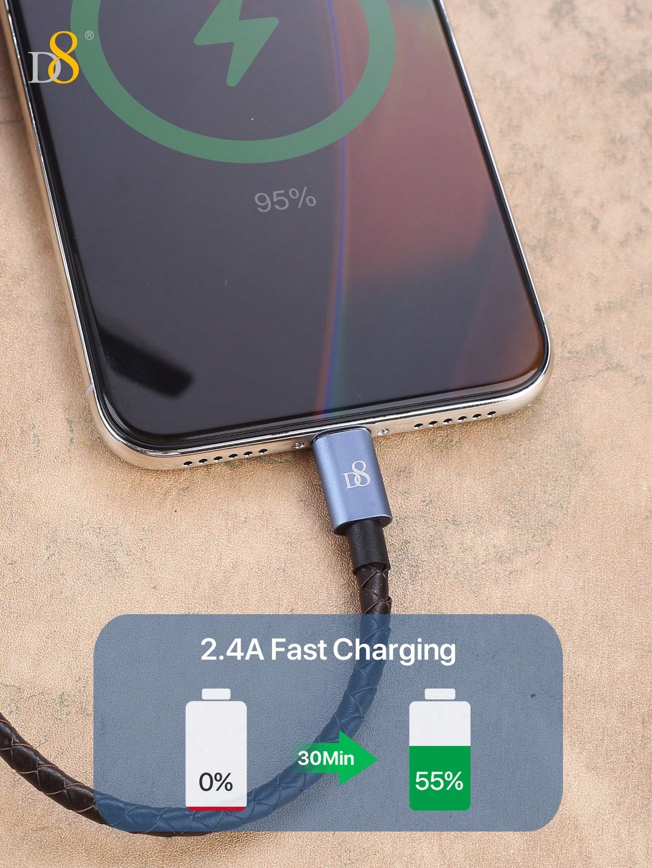 Smartphone with charging cable displaying fast charging feature on a beige background